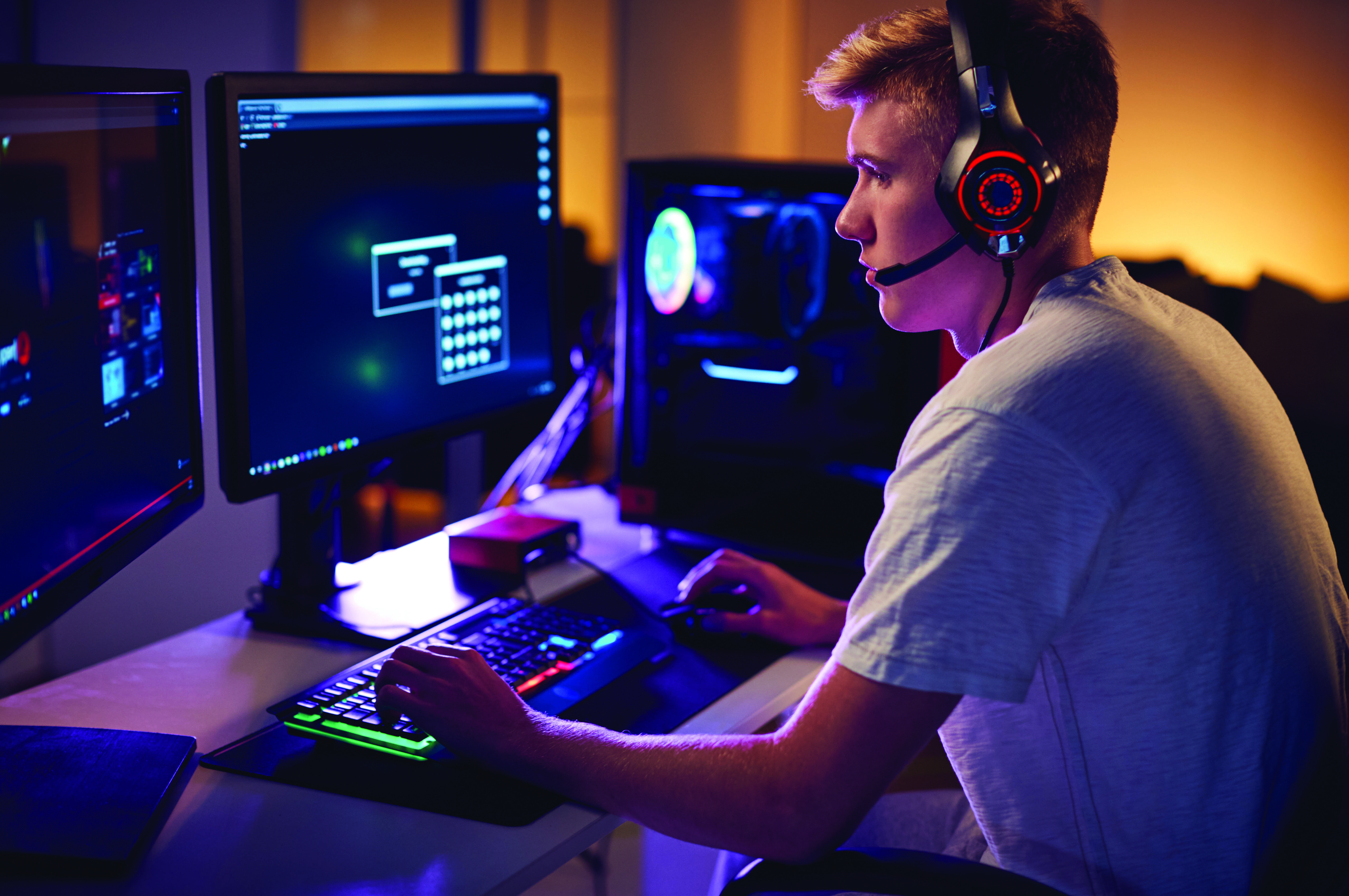 male-teenage-hacker-sitting-in-front-of-computer-s-2021-08-27-09-59-08-utc